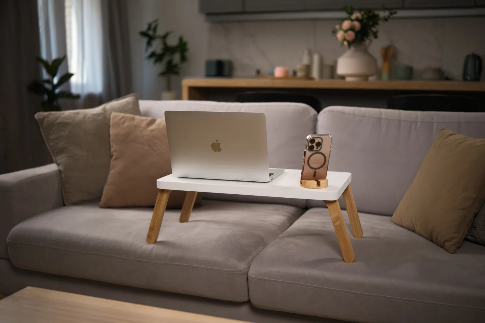 Working on the TablePro table on a sofa.